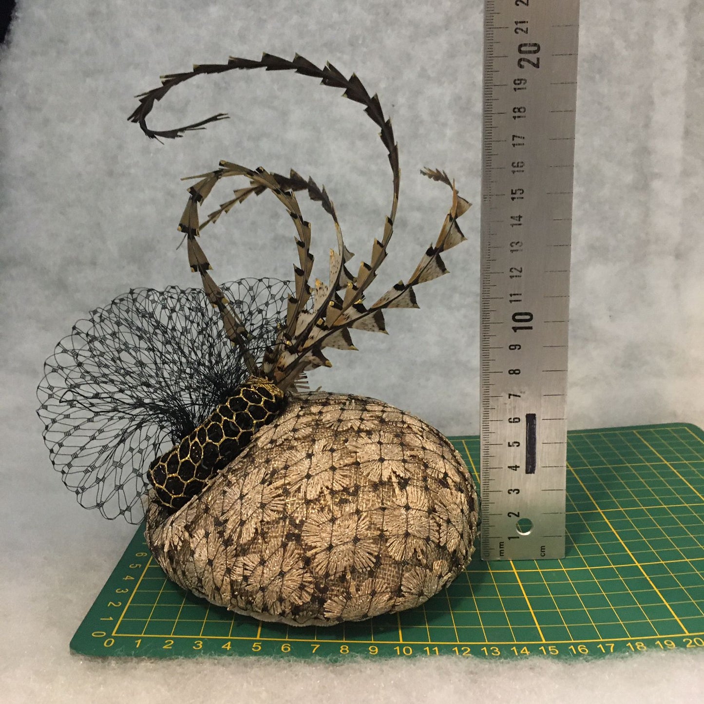 Bambi: Petite Dome Cocktail FascinatorAccented with Pheasant feathers and Black netted Veiling