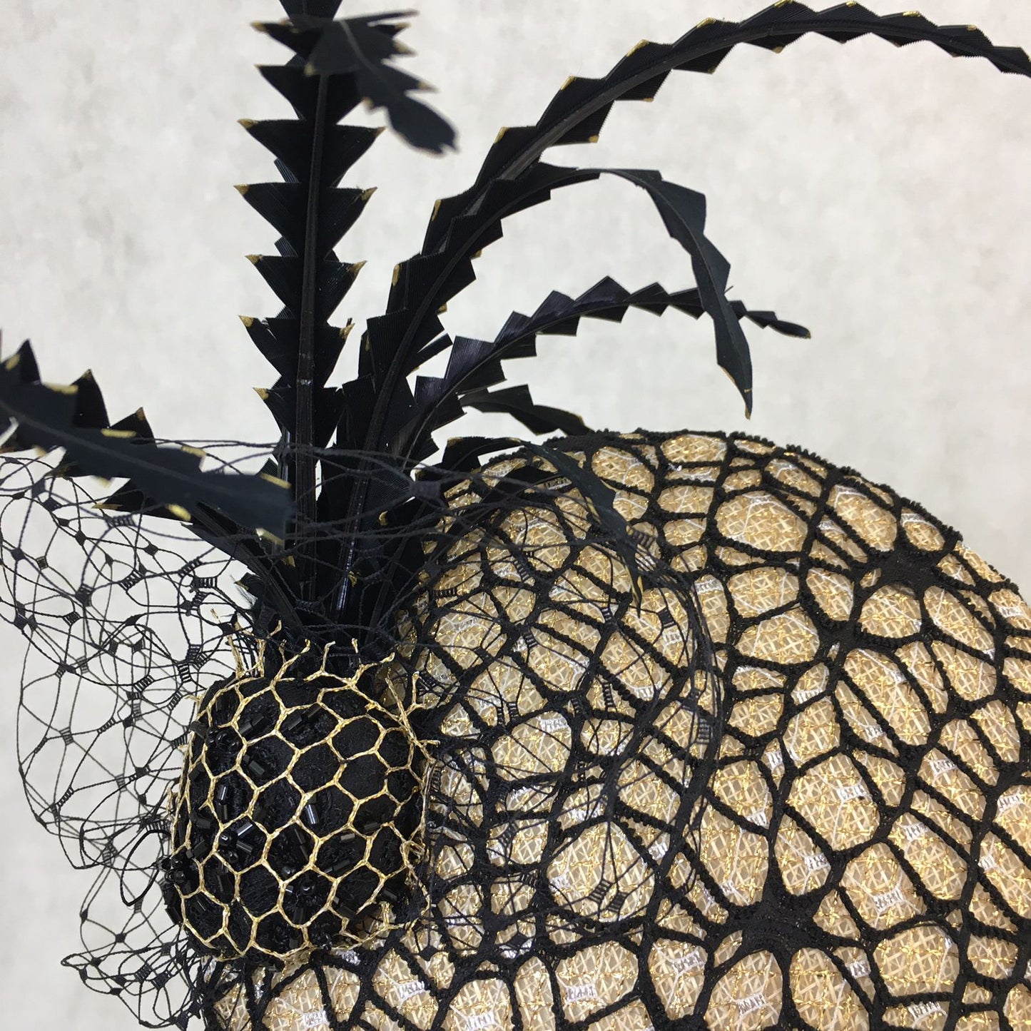 Barbara: Slanted Cocktail Fascinator with Gold Base and Spider Netting, Accented with Feather Spray