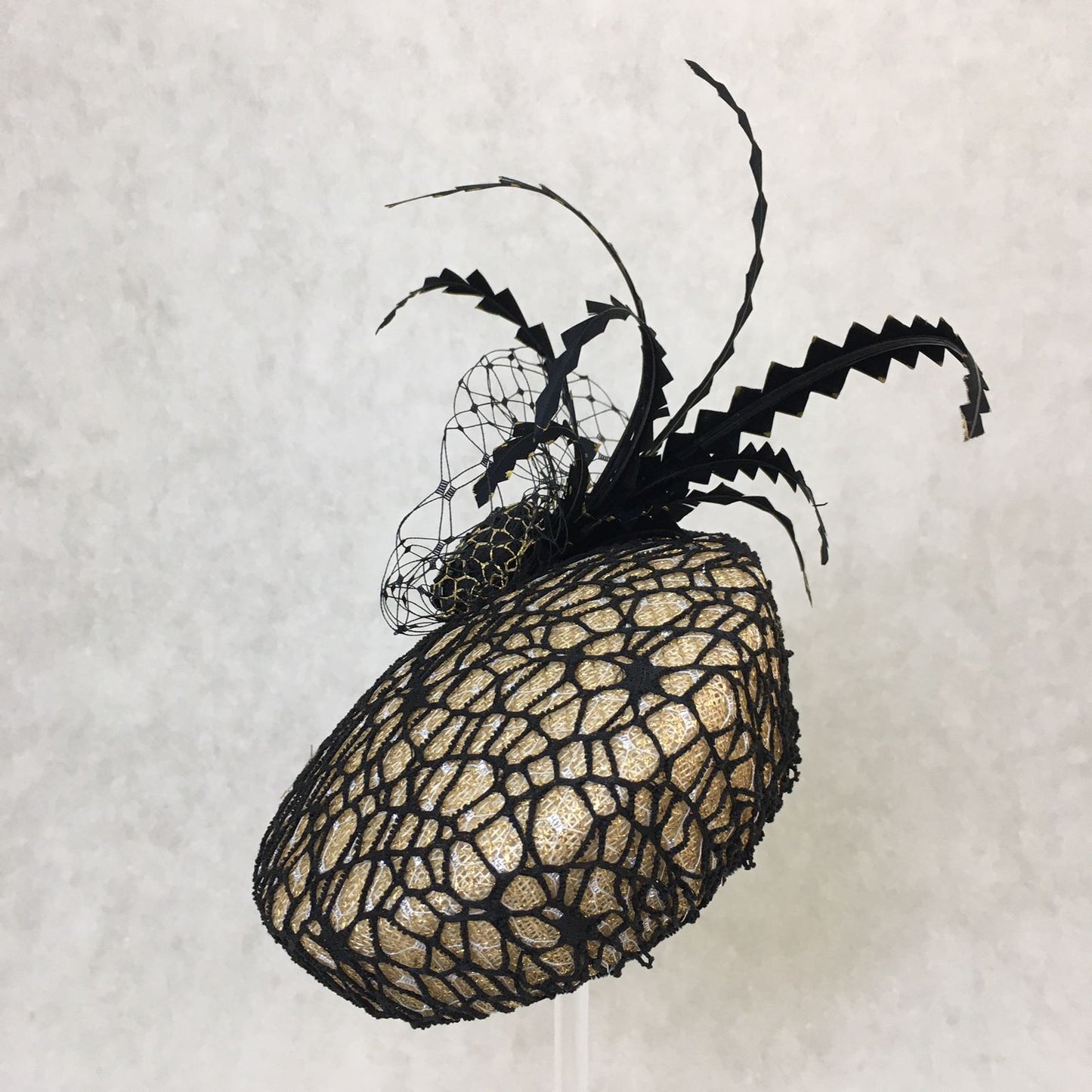 Barbara: Slanted Cocktail Fascinator with Gold Base and Spider Netting, Accented with Feather Spray
