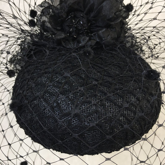 Beatrice: Black Dome Cocktail Fascinator with Black Spotted Veiling Trimmed with Hand Made Flowers