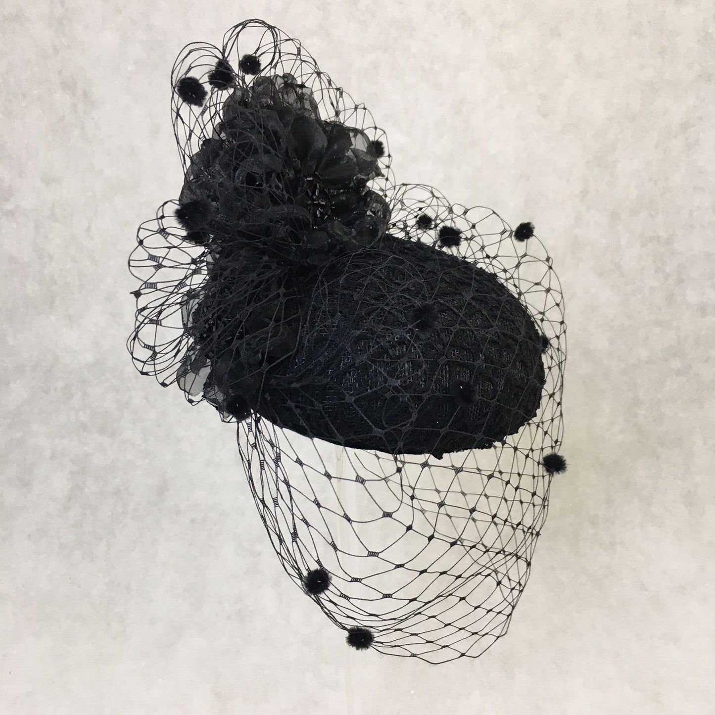 Beatrice: Black Dome Cocktail Fascinator with Black Spotted Veiling Trimmed with Hand Made Flowers