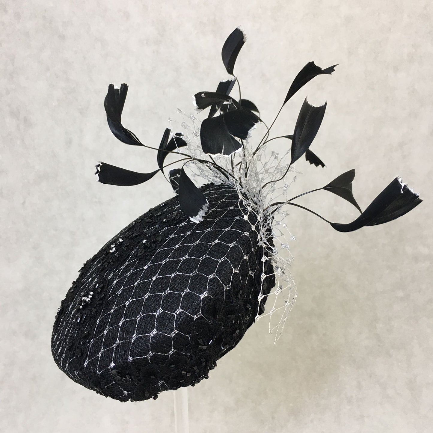 Bethany: Black and Silver Slanted Cocktail Fascinator Accented with Hand Crafted Black Feathers and Silver Veiling