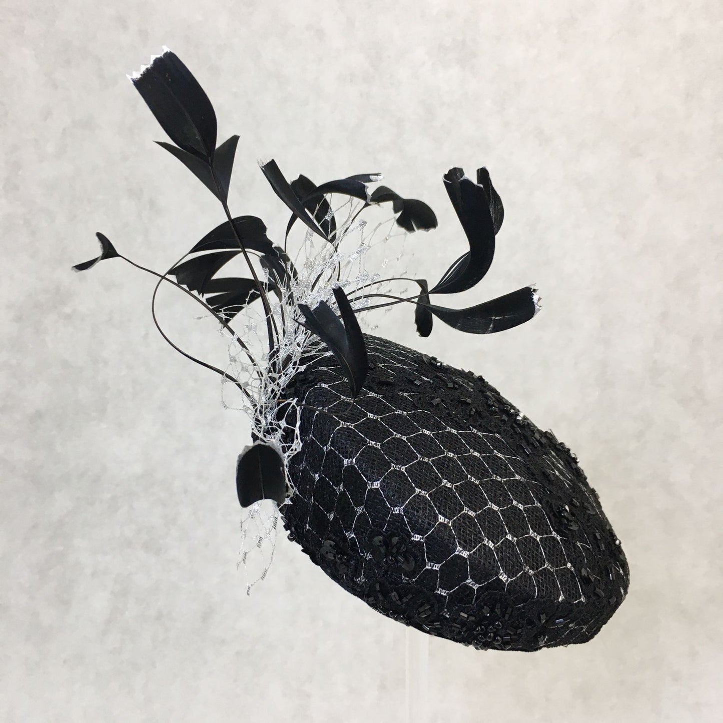 Bethany: Black and Silver Slanted Cocktail Fascinator Accented with Hand Crafted Black Feathers and Silver Veiling