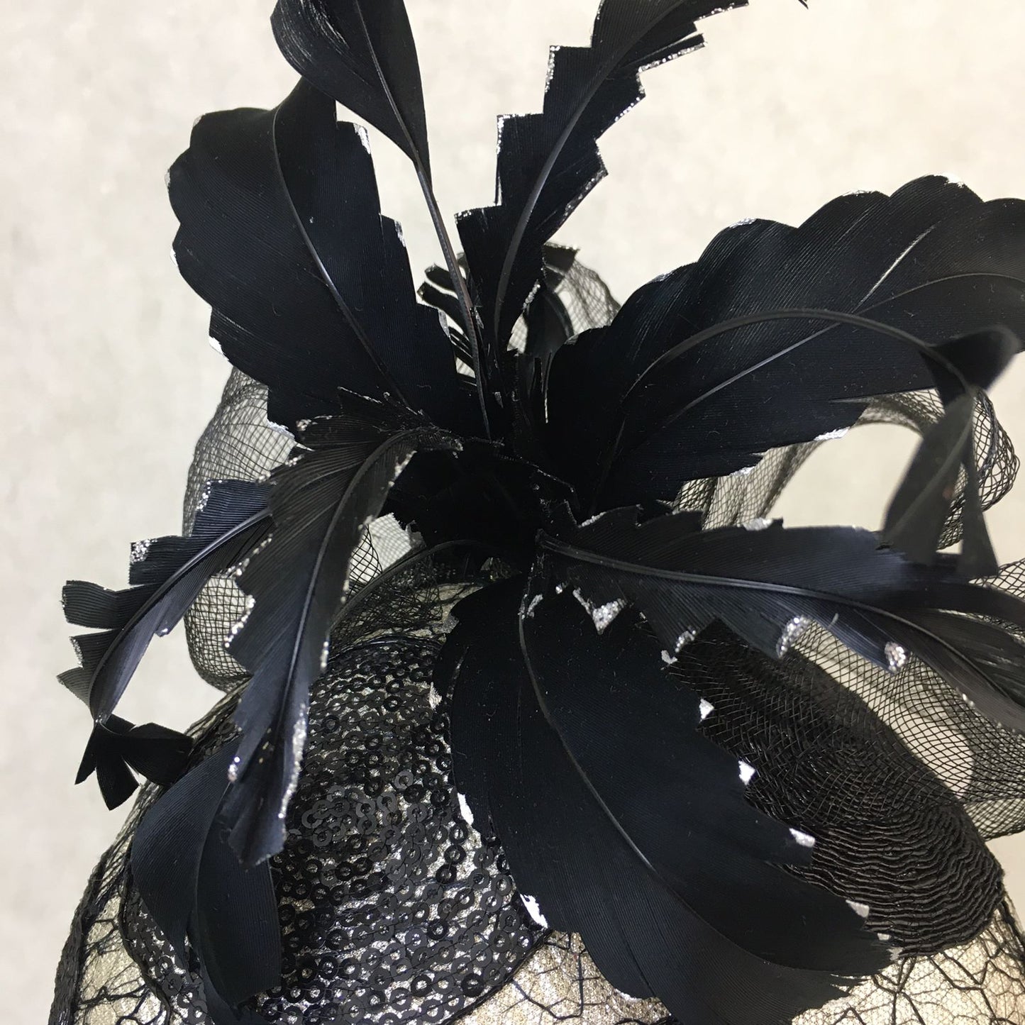 Brianna: Black and Silver Dome Cocktail Fascinator Accented with a Hand Pained Feathers and Distressed Crinoline Bow