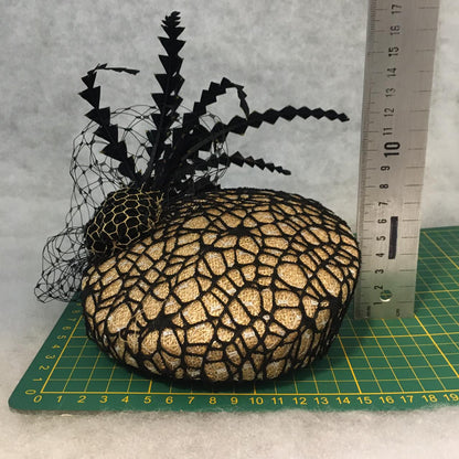 Barbara: Slanted Cocktail Fascinator with Gold Base and Spider Netting, Accented with Feather Spray