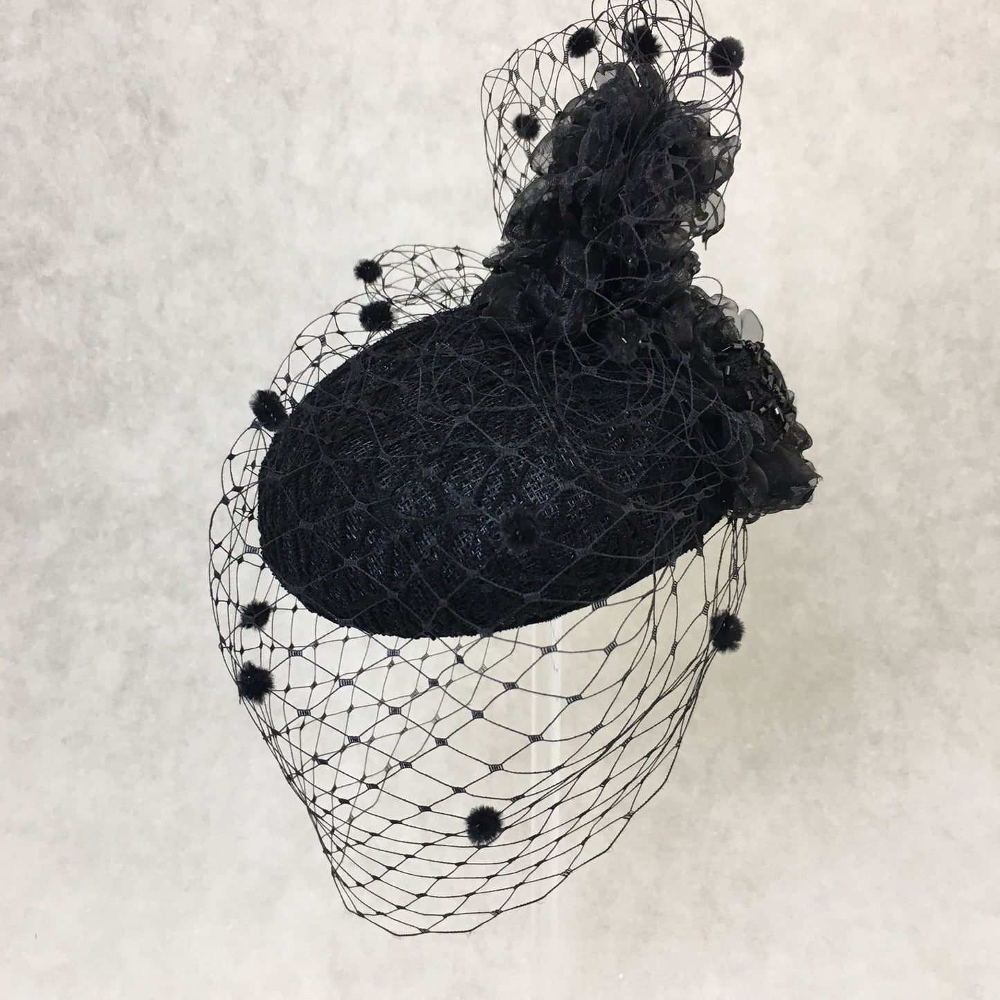 Beatrice: Black Dome Cocktail Fascinator with Black Spotted Veiling Trimmed with Hand Made Flowers
