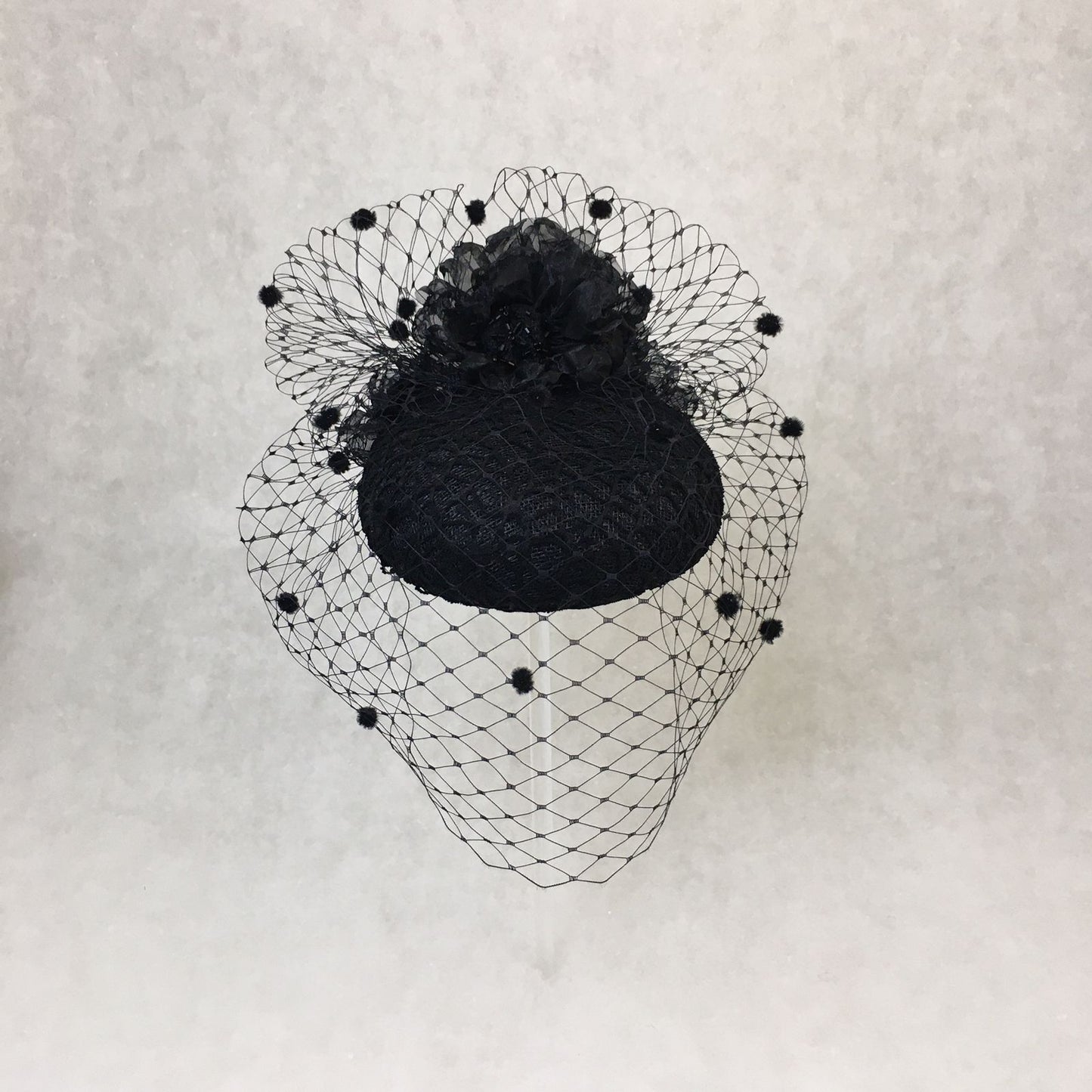 Beatrice: Black Dome Cocktail Fascinator with Black Spotted Veiling Trimmed with Hand Made Flowers