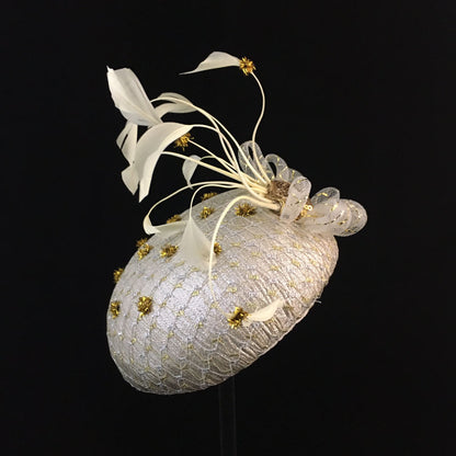 Winnie: Iced Silver Dome Cocktail Fascinator Accented by Gold Dots and Cream Feather Spray